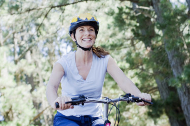Woman bike riding in remote area