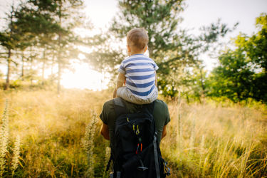Baby boy with daddy in the nature